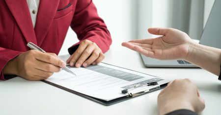 Business people hold a resume and talk to job applicants for job interviews about careers and Their personal history in the company. Recruitment concepts.