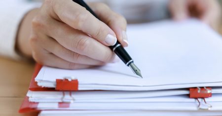 Auditor business woman checking documents, issuing report for legal preparation. Organizes accounting data. Business documents, Tax time