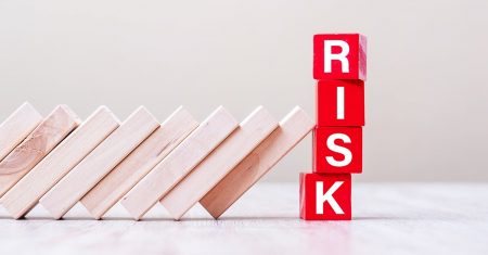 Red RISK cube blocks stop falling blocks on table. fall Business, planning, Management, Solution, Insurance and strategy Concepts
